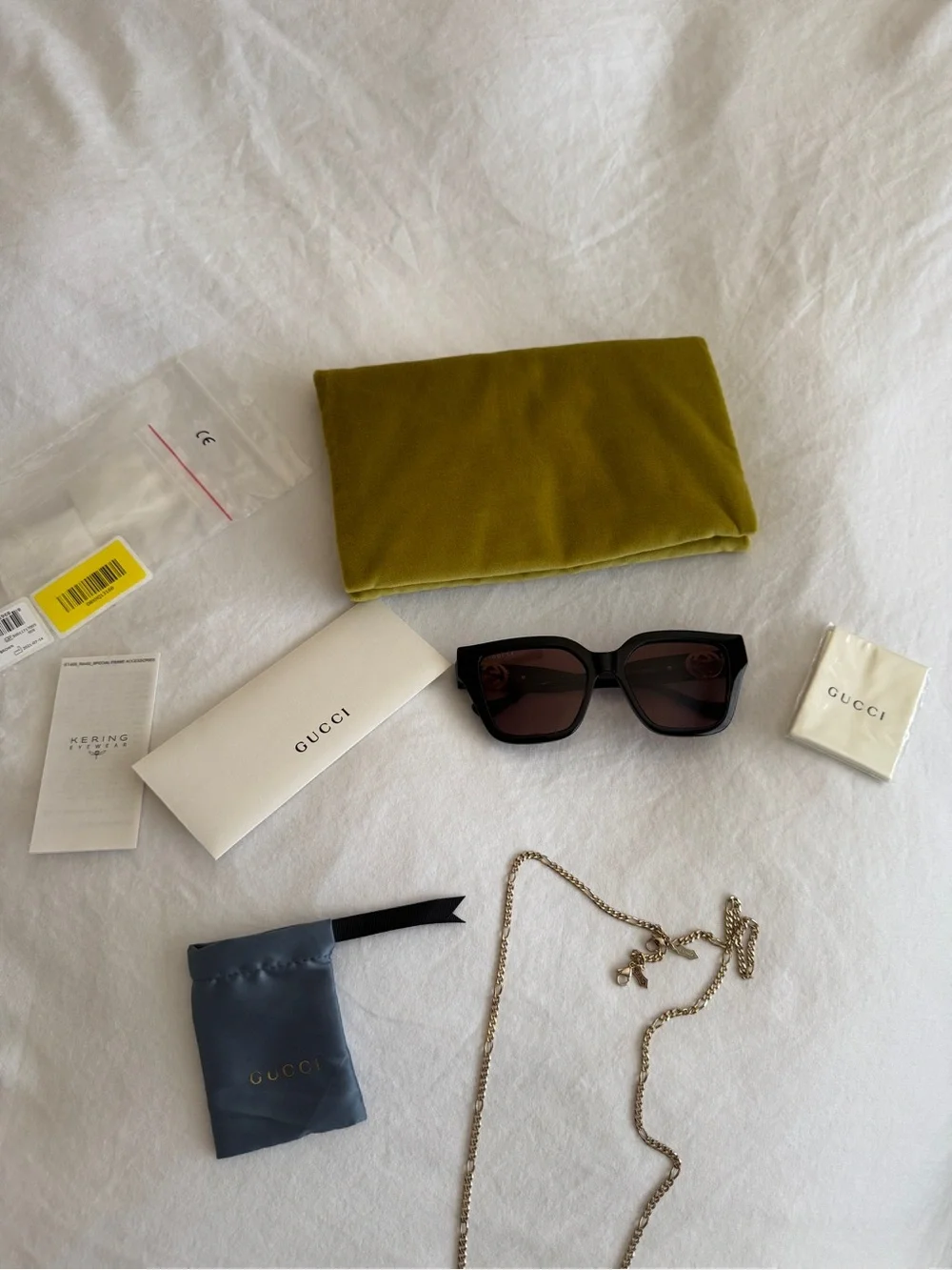 Gucci gold chain sunglasses with brown lenses